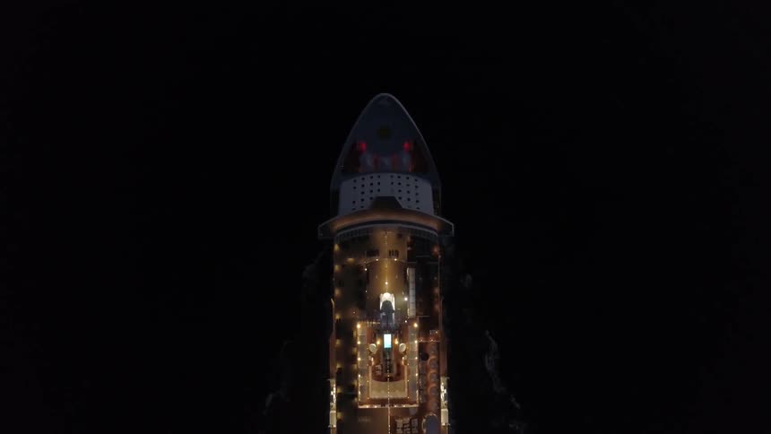 Aerial view of cruise ship in the ocean at night