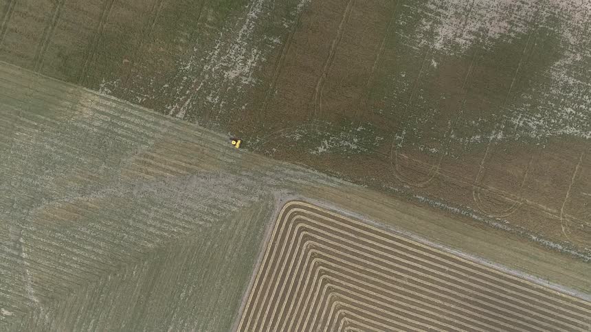 Machine moves across ground creating straight row