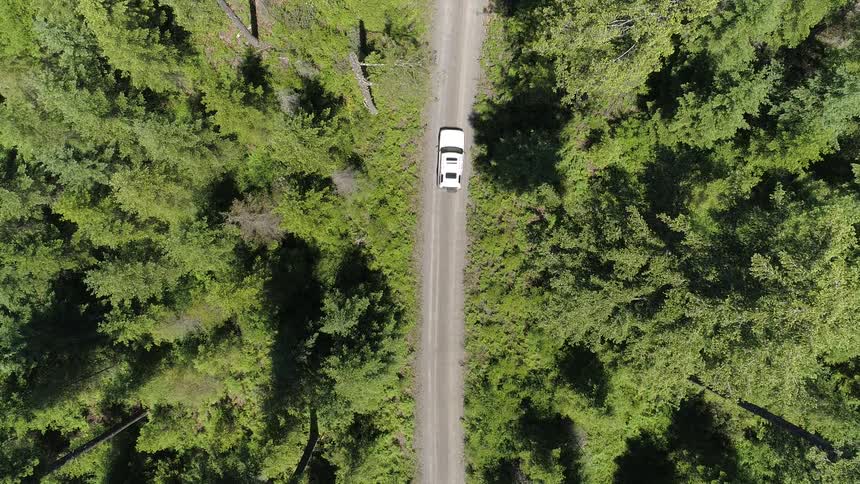 A car drives down the road