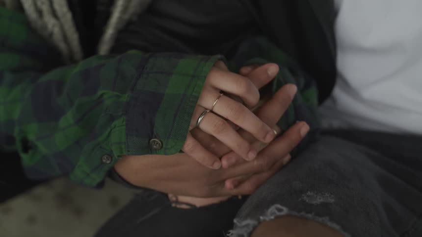 Man and woman holding hands