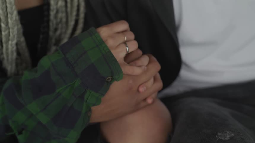 People interlocking hands