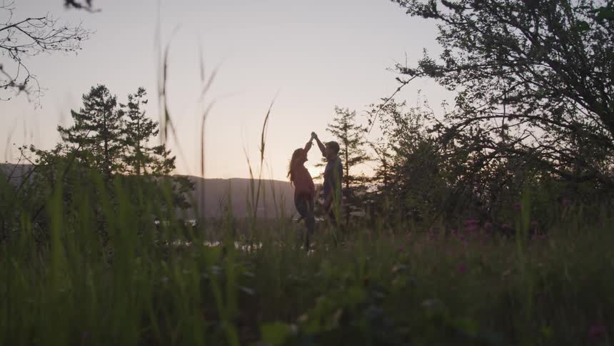 Girl ad boy dancing in the woods