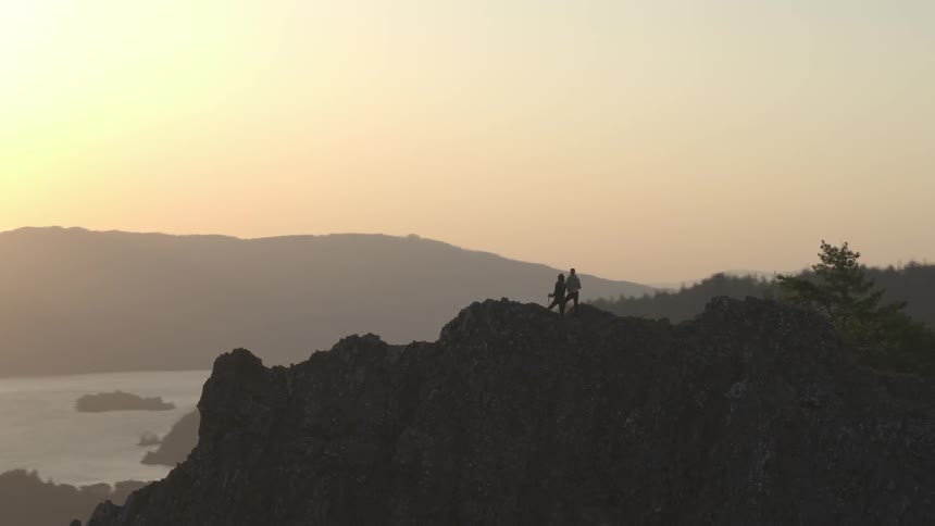 Two peopleare standing on a mountain structure
