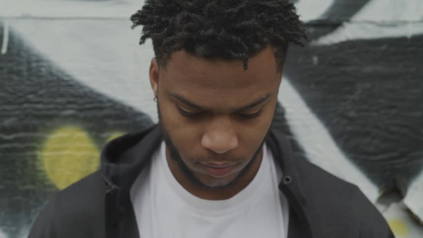 A man stares down