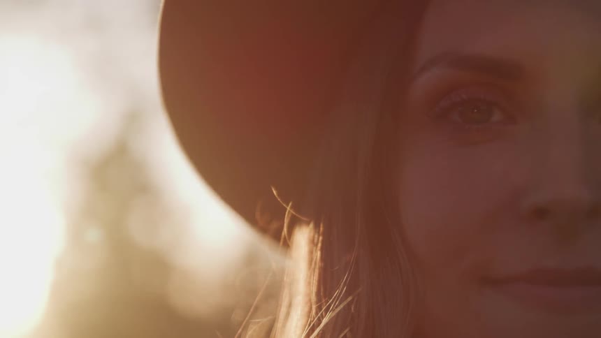 A woman stares in to the camera