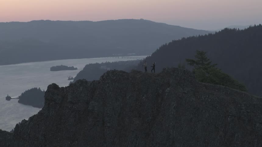 Humans hiking up a hill