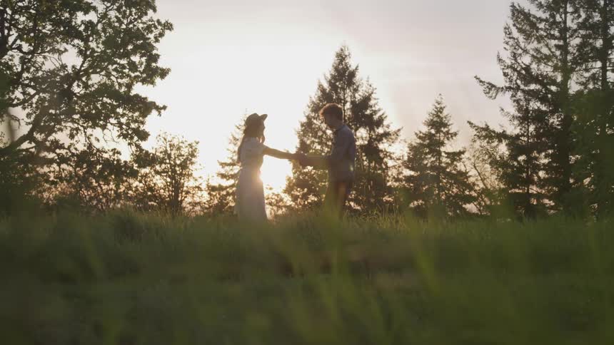A couple dances in the long grass