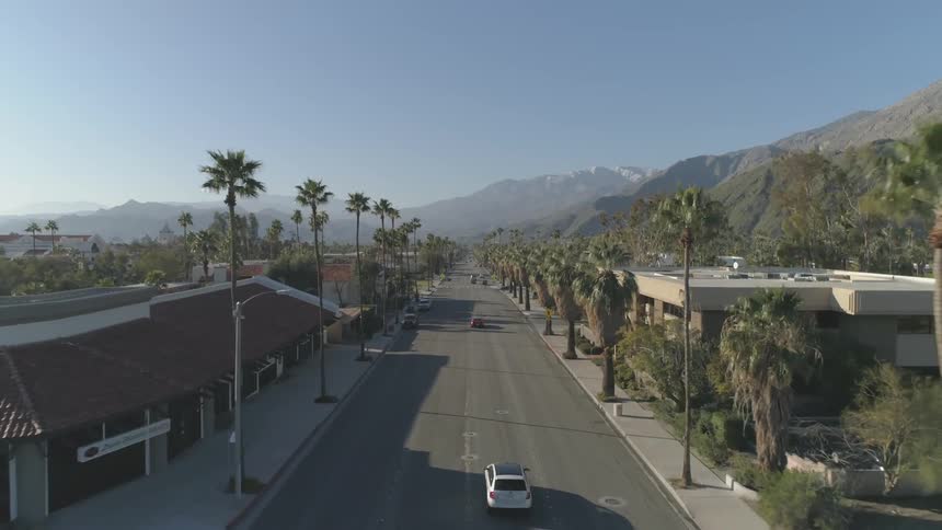 Aerial view of cars driving down a street