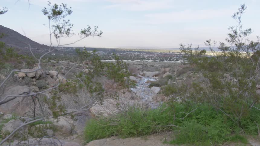 Skyline view of a rocky hill with a neighborhood in the background