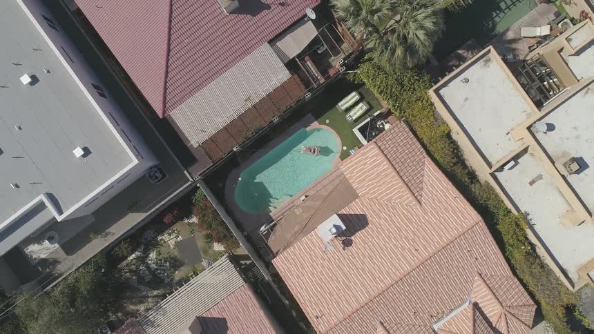 Person enjoying their pool on a floaty