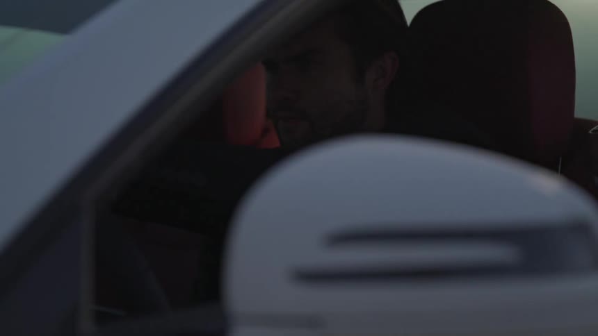 A man driving a car