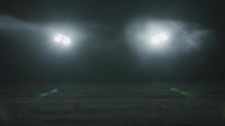 Headlights and mist on a dark night