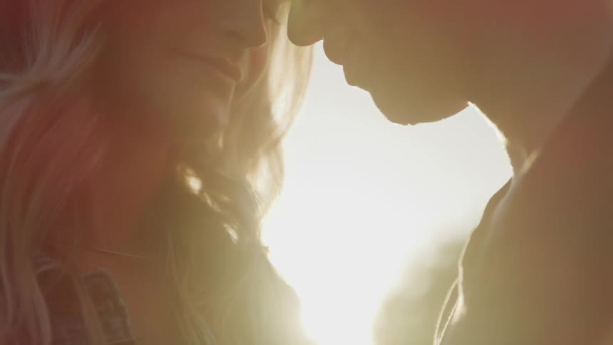 A man and a woman putting their foreheads together