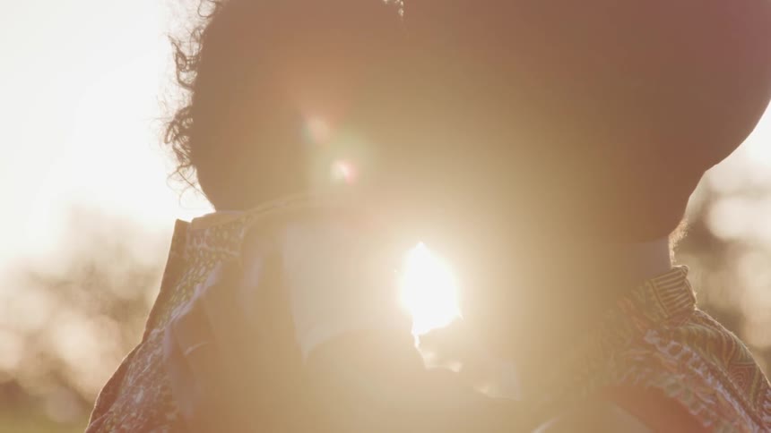 Two people stare into the sun