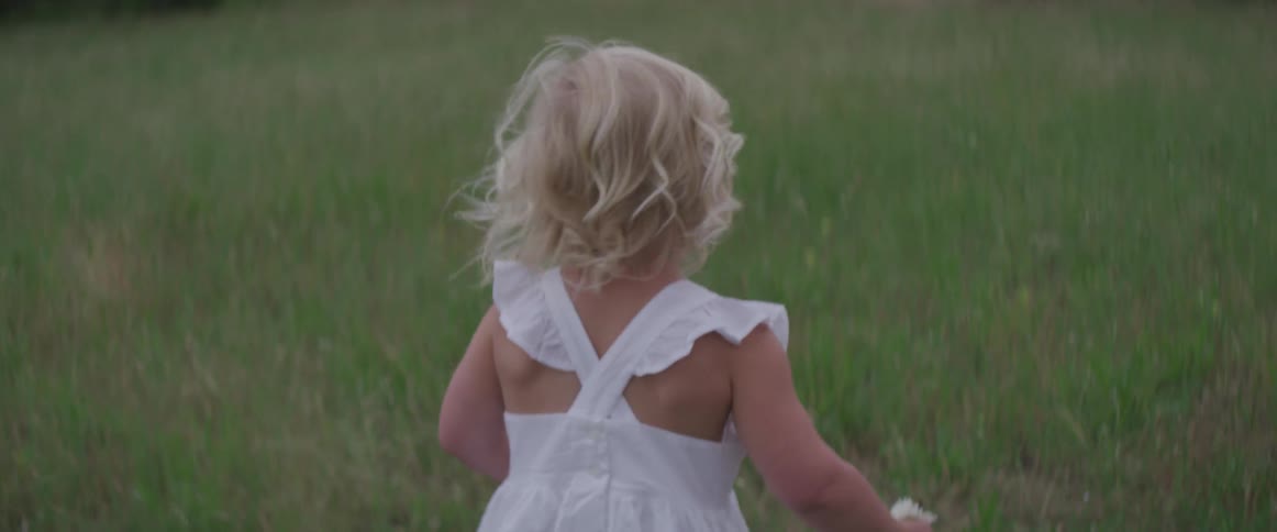 Girl walking in a field