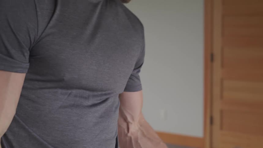 Man curling dumbells