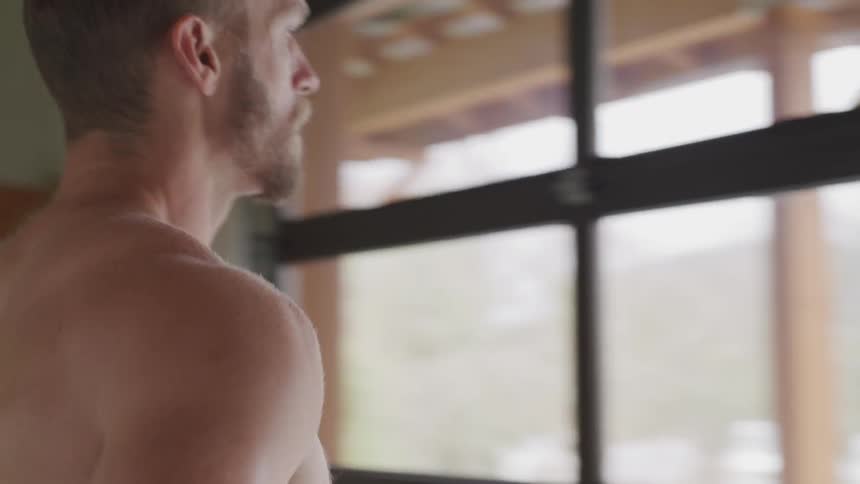 Shirtless man do warm up before work out