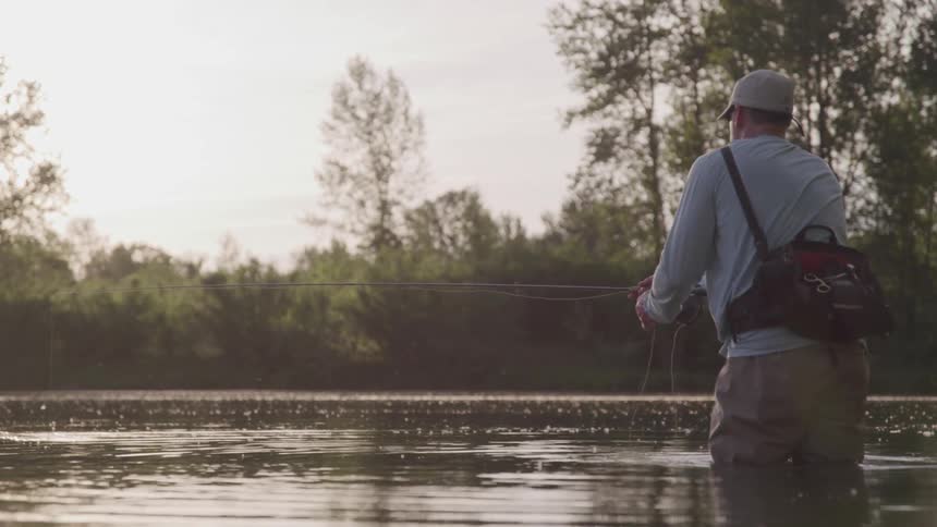 A man pulls on a fishing pole line