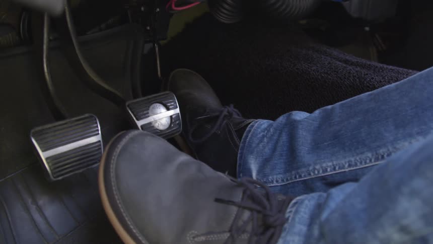 A man is driving a car