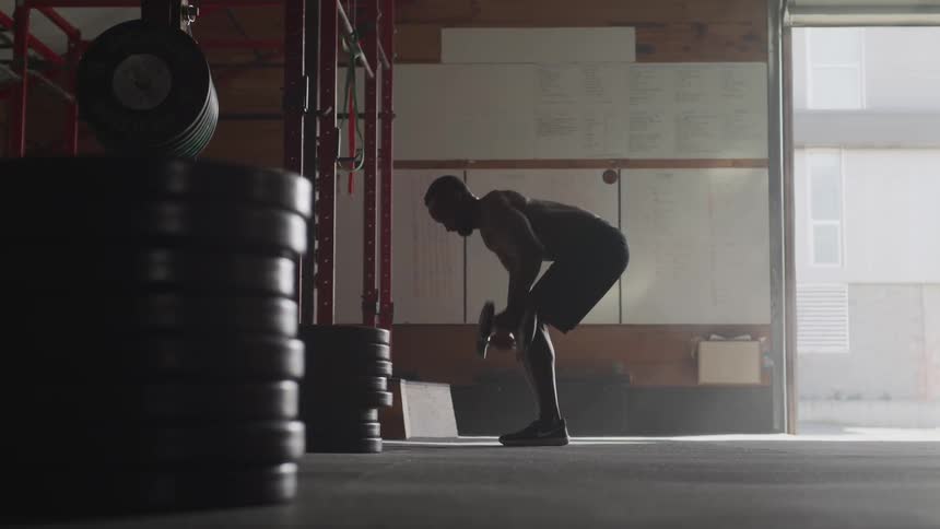 Man curling weights