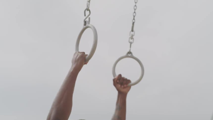 Black man on the rings