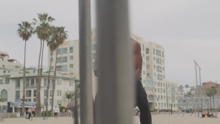 A man works out on the beach