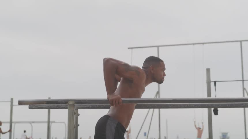 A man exercises at a park