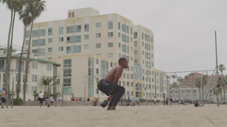 Black man workout at the beach