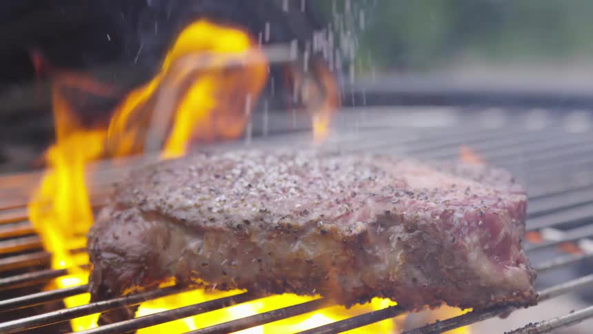 Meat cooking on grill