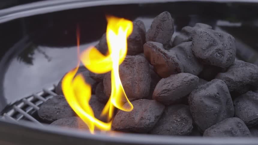 Charcoal in a barbecue grill on fire