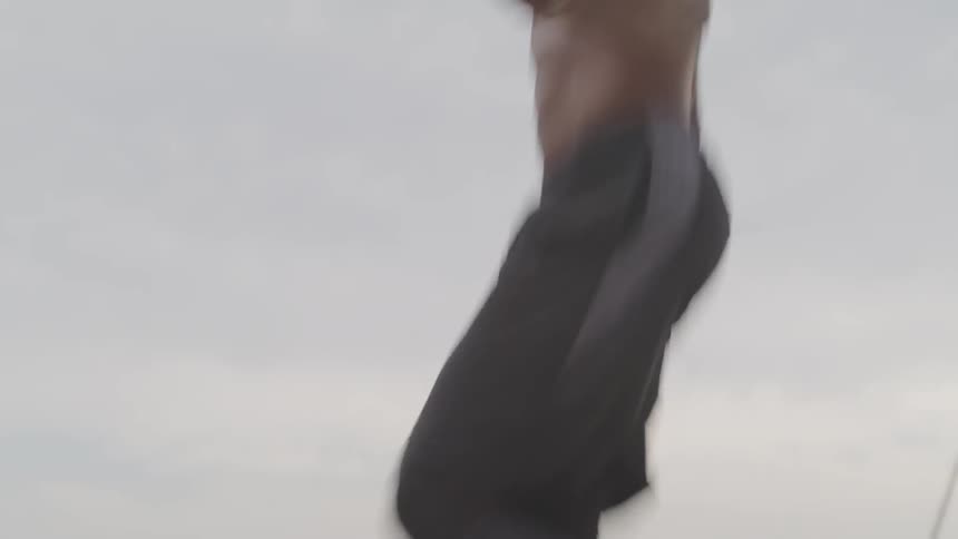 A man is jumping rope outdoors