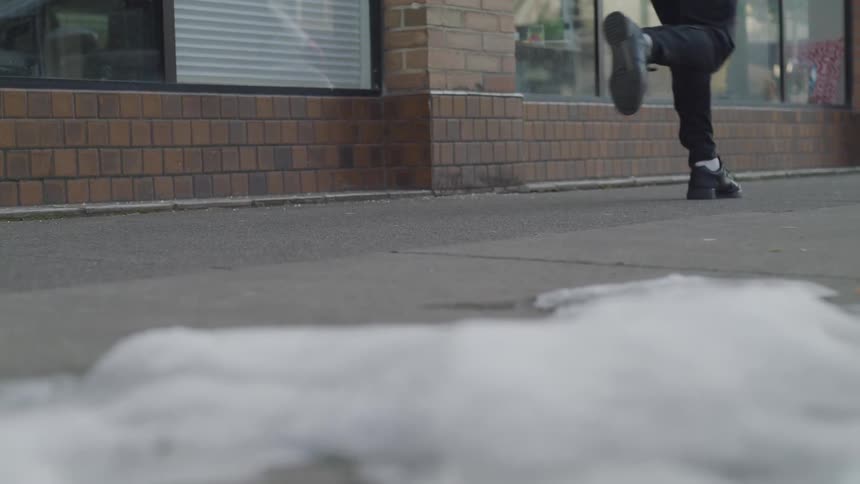 Someone is running through pedestrian on the winter season