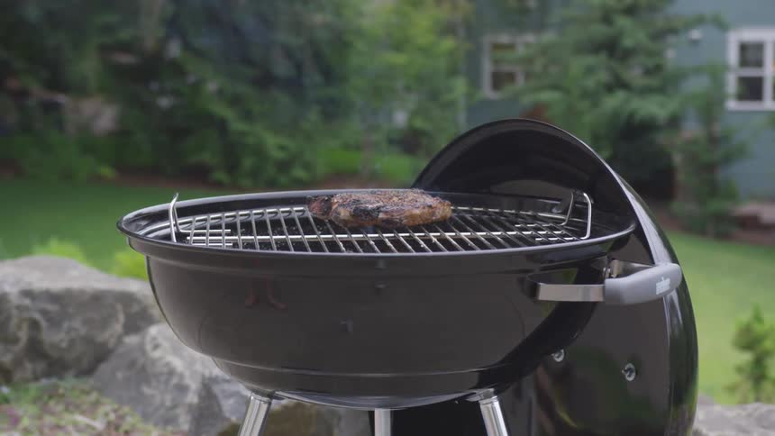 Meat sitting on a grill outside