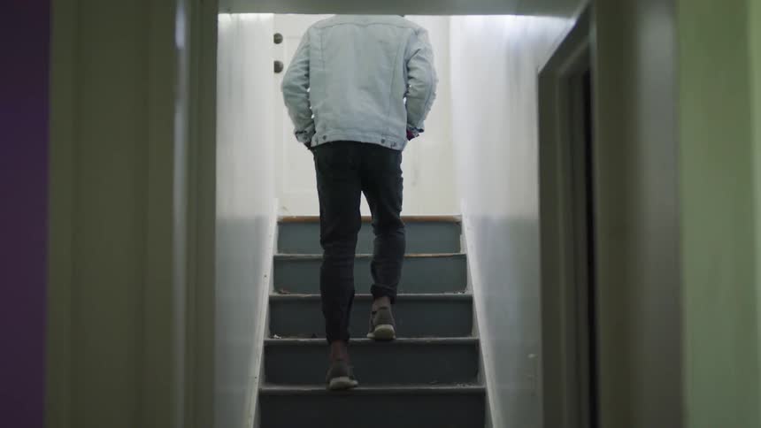 Man walking up steps