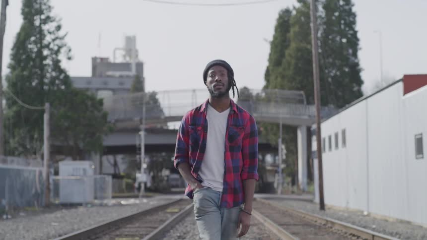 Man walking near train track