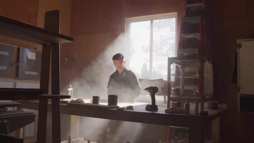A man works at his work station