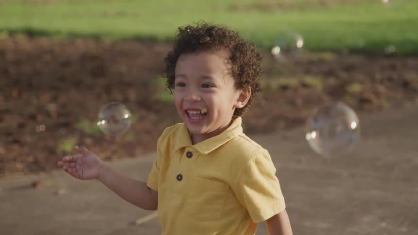 Boy playing with bubbles