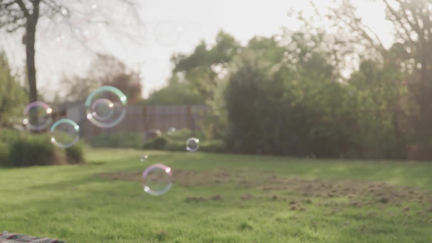 Bubbles float down from the sky
