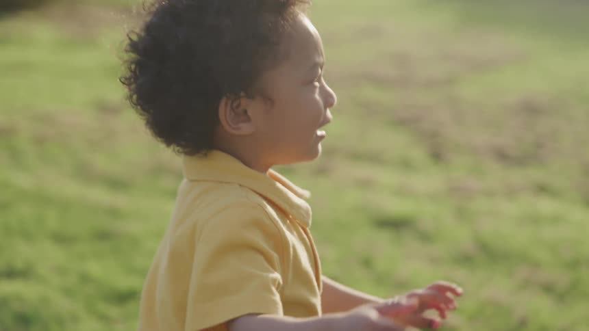 A child running outdoors during the day