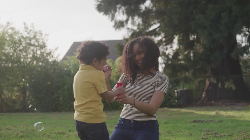 A mother and a child bubbles together