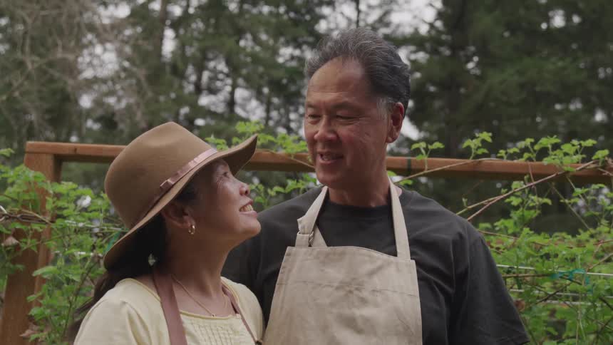 Elderly couple looking at each other