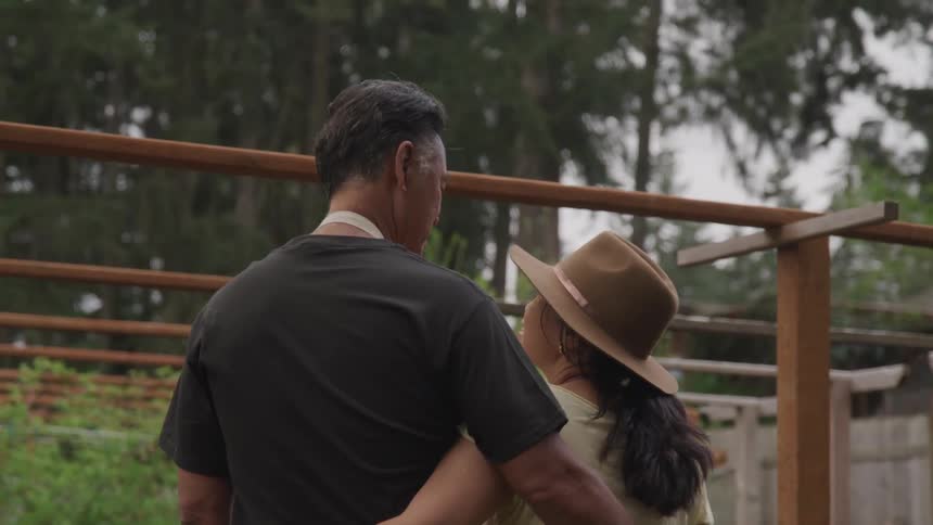 Two people holding one another
