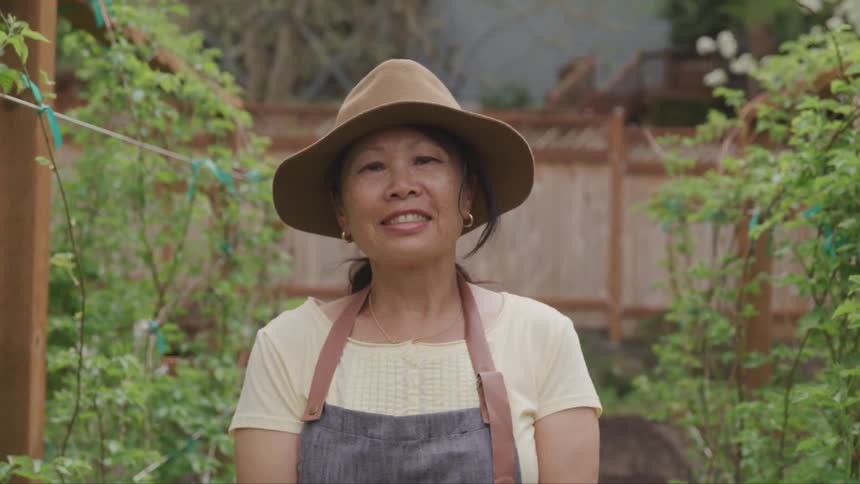 A woman looks on to the camera