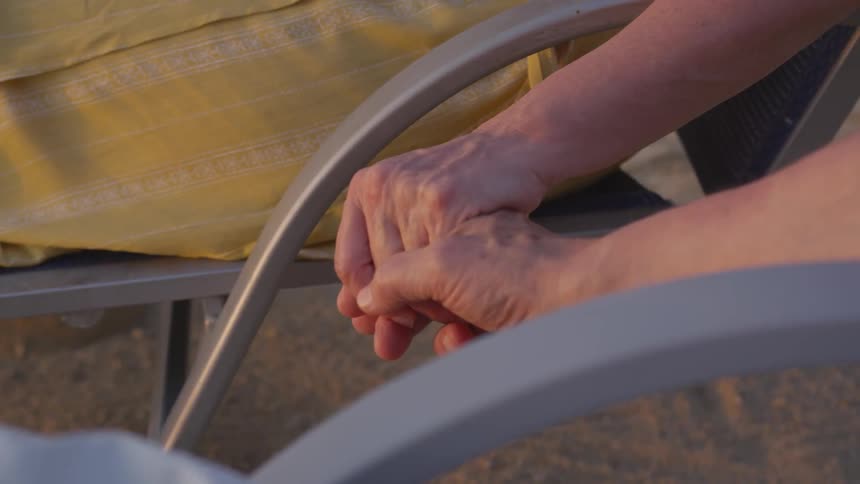 Two people holding hands