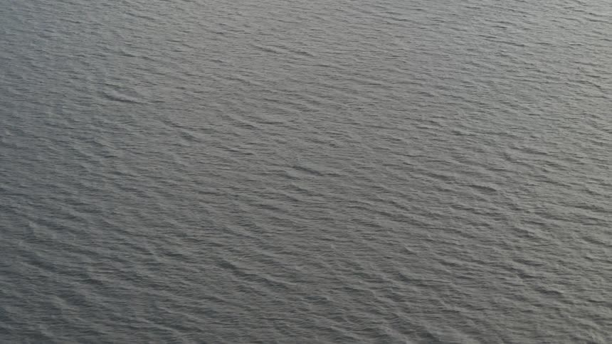 Waves are moving along the ocean