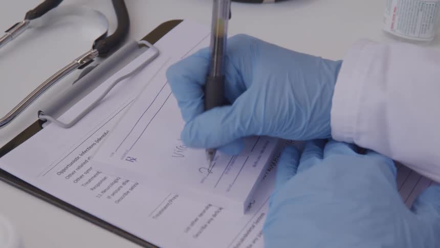 Doctor writing out a prescription