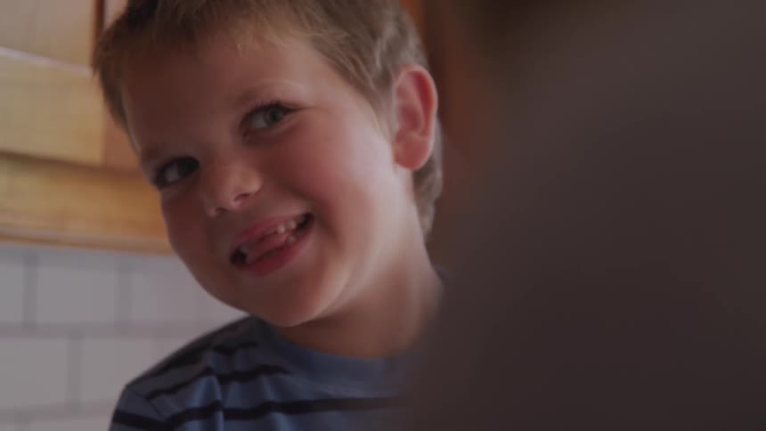 A young boy smiles