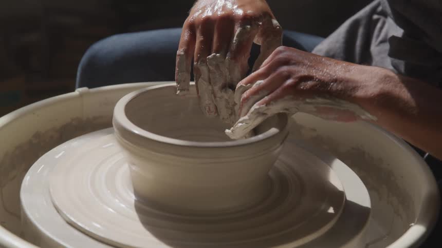 Man spinning clay