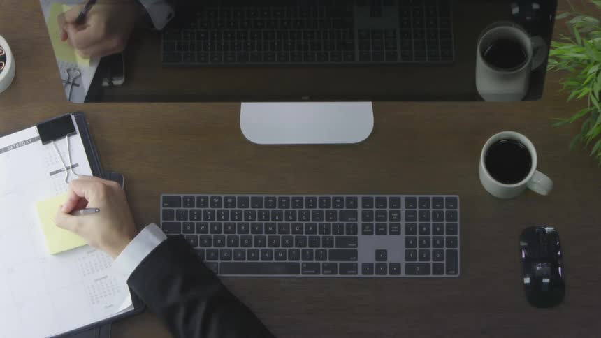 Man typing at a computer