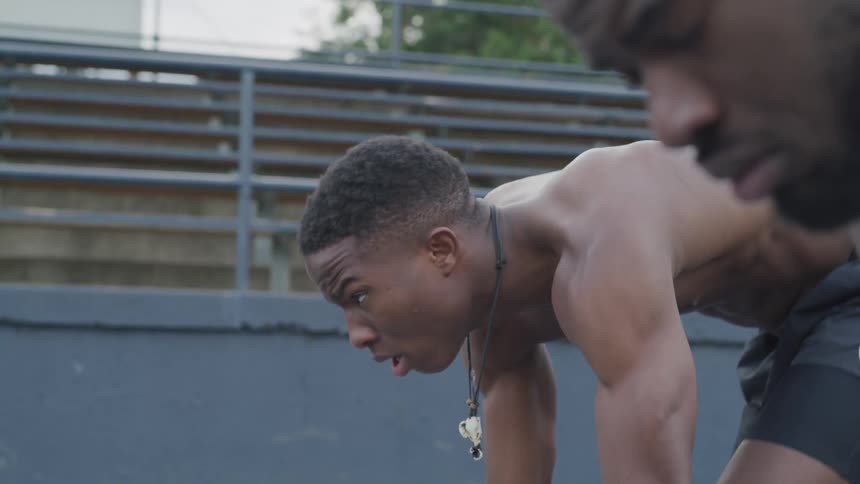 Two young men run against one another